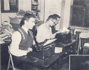 1958 Ticker staff working at typewriters